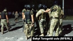 Policemen blocking the road to Koi Tash, August 8 2019