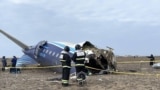 In this handout picture released by Kazakhstan's emergency situations ministry, emergency specialists work at the crash site of an Azerbaijan Airlines passenger jet near the western Kazakh city of Aktau on December 25, 2024. (