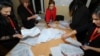 AZERBAIJAN -- Members of a local electoral commission count ballots at a polling station after a snap parliamentary election in Baku, February 9, 2020